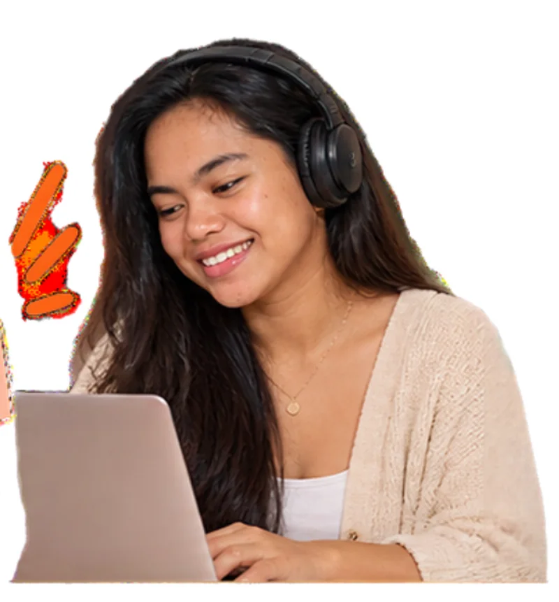 An assistant with headphones smiling while working on a laptop